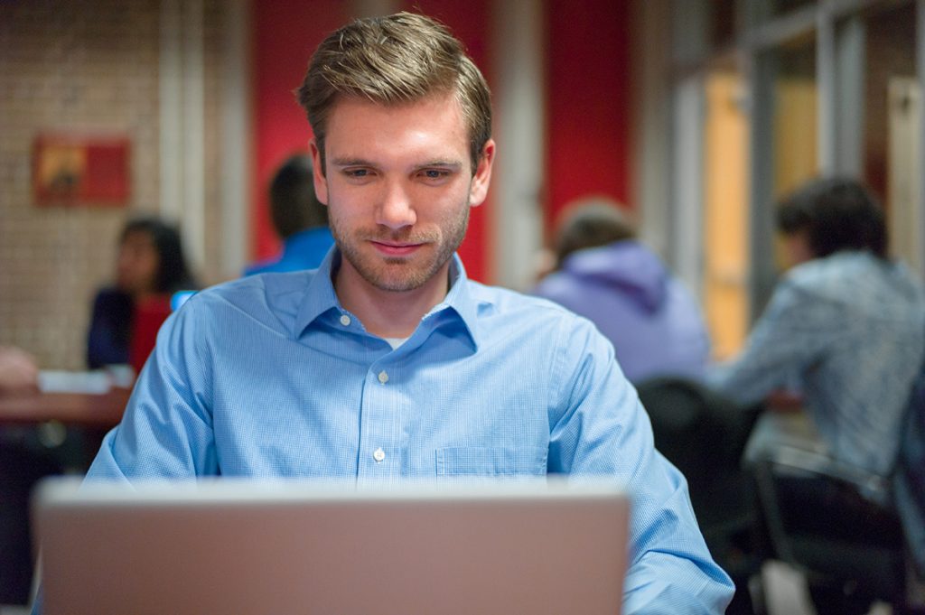 Student in Commerce Lounge