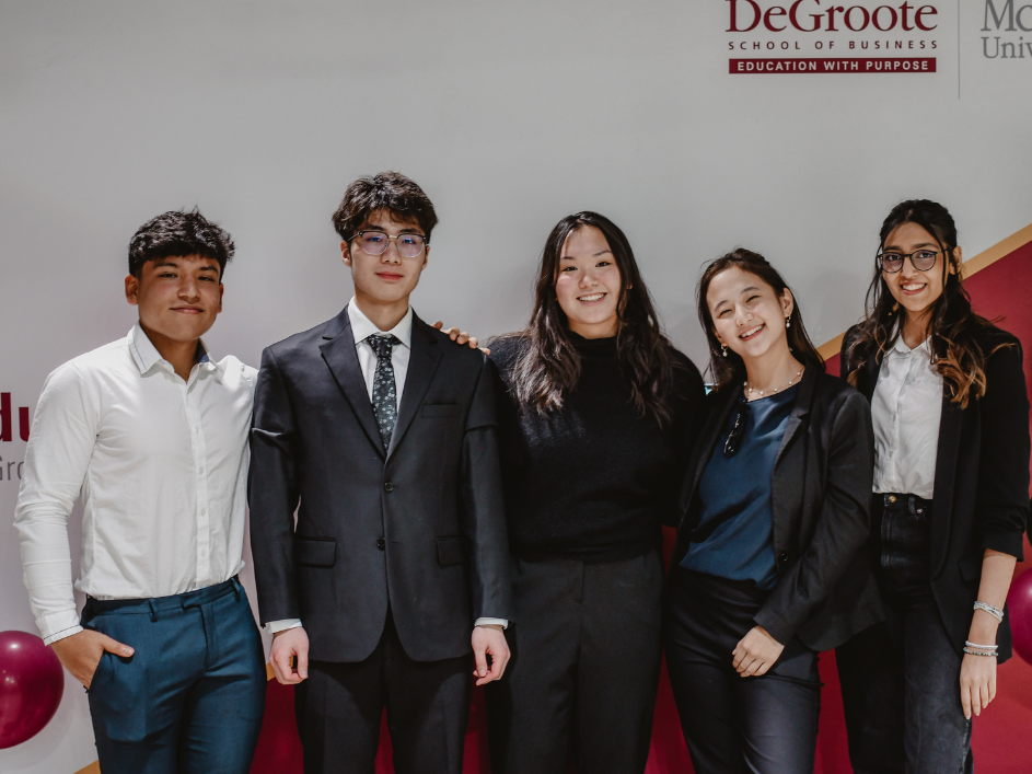 Undergraduate-FAQ. A formal image captures the unity and ambition of DeGroote School of Business students, as they stand together, prepared to excel in their business studies.
